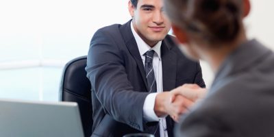Manager interviewing a female applicant in his office