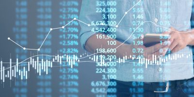 Businessman plan graph growth and increase of chart positive indicators in his business