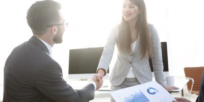 welcome and handshake of business people in the office. the concept of partnership