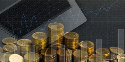 Double exposure of coin stack with office supplies, columns of coins on office work essential tools or item, business and financial concept idea.