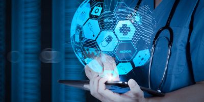 Health care and medical services concept with world or global form and AR interface.Doctor working on a digital tablet with digital background as concept