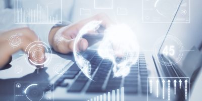 Double exposure of market chart with man working on computer on background. Concept of financial analysis.