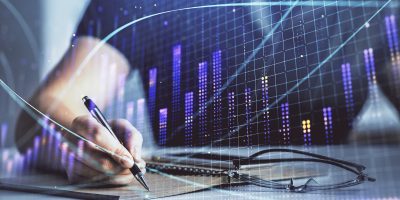 Multi exposure of woman's hands making notes with forex graph hologram. Concept of technical analysis.