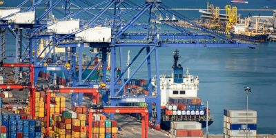 Landscape from bird view of Cargo ships entering one of the busiest ports in the world, Singapore.