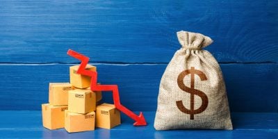 Dollar money bag with boxes and down arrow. Income decrease, slowdown and decline of economy. Bad consumer sentiment and demand for goods. Low sales. Production decline. Reduced transportation prices.