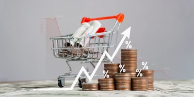inflation Increased product sales growth basket growth, market or consumer price index concept shopping cart with food increase with arrow graph on the coin inflation VAT