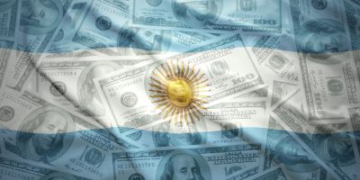 colorful waving argentinean flag on a american dollar money background