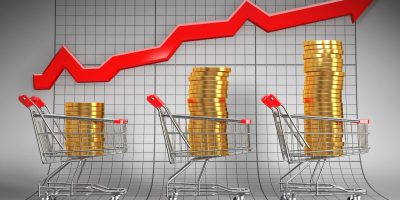 Sales growth. Shopping basket with coins. 3d