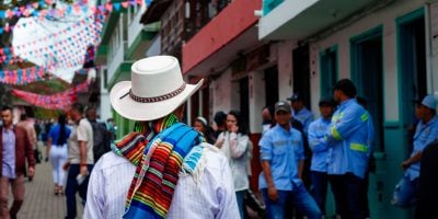 Jerico, Colombia - January 14, 2023: Peasant with hat and poncho walks through the streets of the town